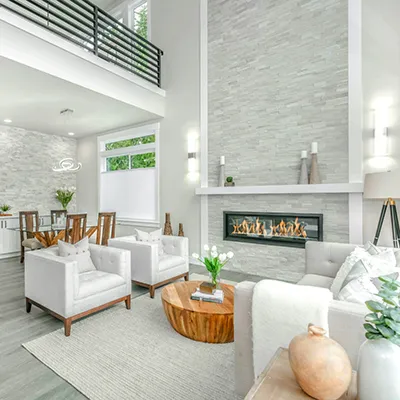 Elegant living room with fireplace and second floor overlook
